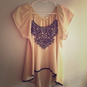 Cream shirt with black flower accents